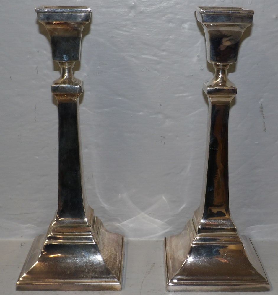 Pair of Silver Plated Candlesticks: Pair of Silver Plated Candlesticks . 10 1/2" H "ALL DESCRIPTIONS AND ANY CONDITION STATEMENT GIVEN BY LANGSTON AUCTION GALLERY ARE STRICTLY OPINIONS AND LANGSTON'S SHALL HAVE NO RESPONSIBILITY FOR ERR