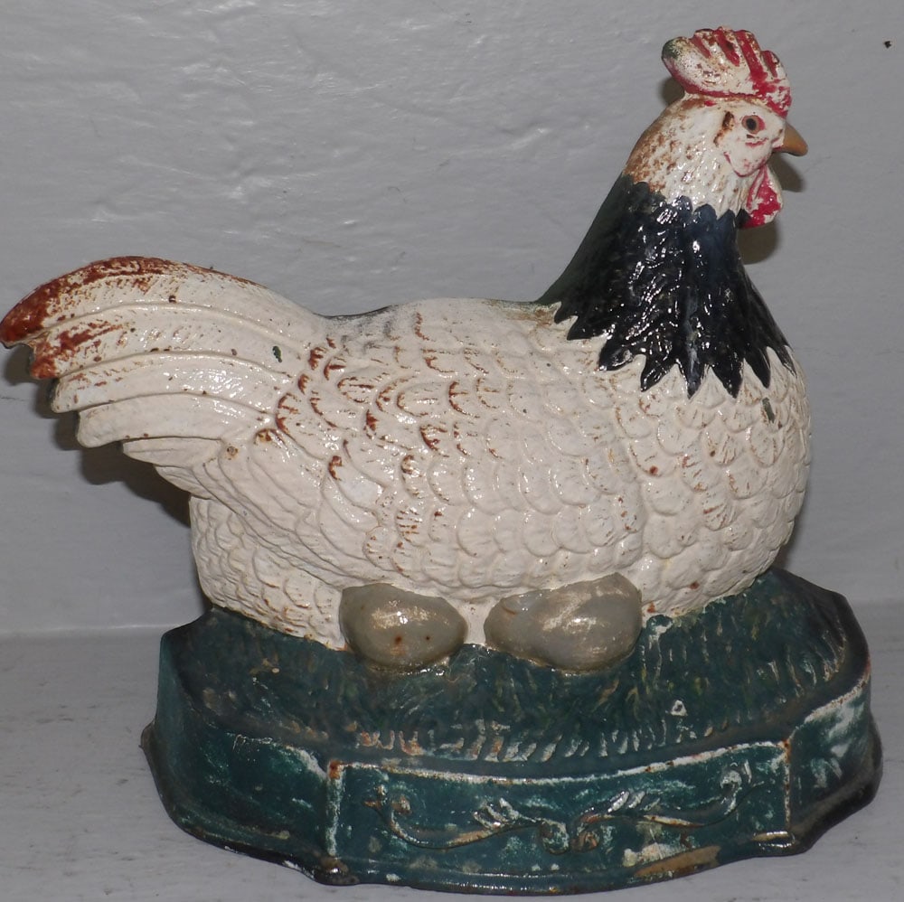 Painted Cast Iron Chicken on Nest Door Stop: Painted Cast Iron Chicken on Nest Door Stop. 10" W 8 1/2" H "ALL DESCRIPTIONS AND ANY CONDITION STATEMENT GIVEN BY LANGSTON AUCTION GALLERY ARE STRICTLY OPINIONS AND LANGSTON'S SHALL HAVE NO RESPONSIB