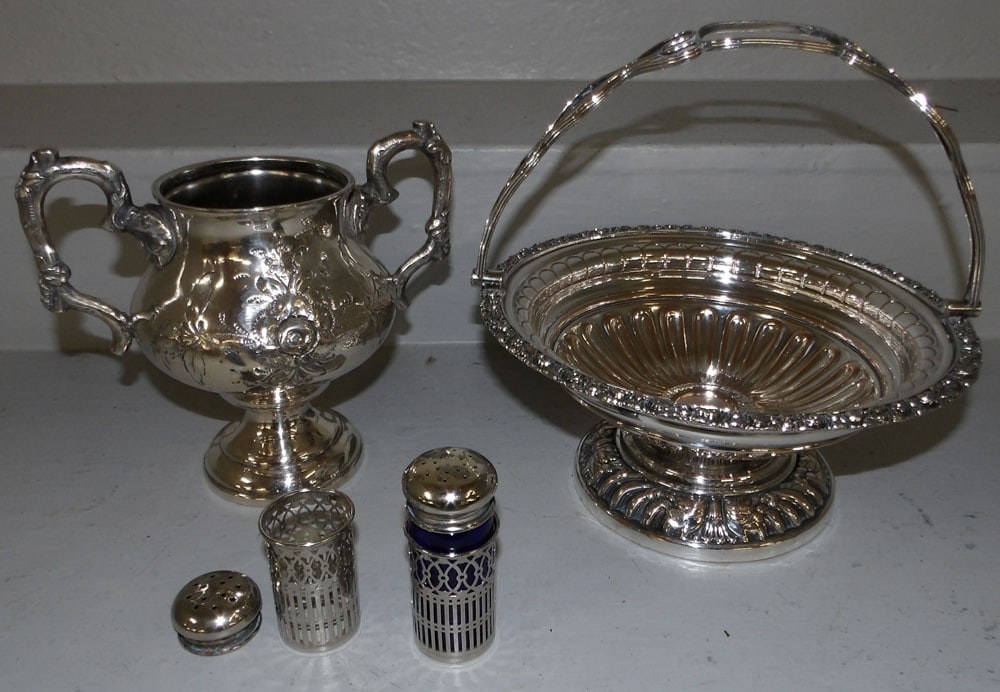 four pieces of silver plate: four pieces of silver plate. Up to 9 1/2" H "ALL DESCRIPTIONS AND ANY CONDITION STATEMENT GIVEN BY LANGSTON AUCTION GALLERY ARE STRICTLY OPINIONS AND LANGSTON'S SHALL HAVE NO RESPONSIBILITY FOR ERRORS