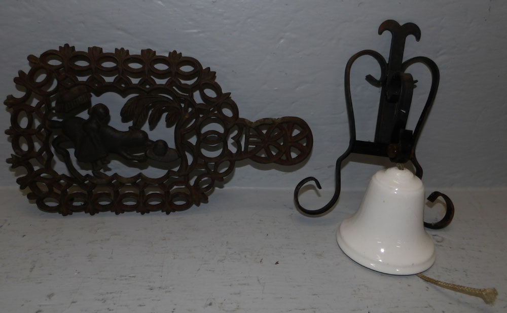 Virginia Metalcrafters Little Red Riding Hood cast iron trivet and metal and porcelain bell: Virginia Metalcrafters Little Red Riding Hood cast iron trivet and metal and porcelain bell. Up to 11 1/4" L "ALL DESCRIPTIONS AND ANY CONDITION STATEMENT GIVEN BY LANGSTON AUCTION GALLERY ARE STRICTL