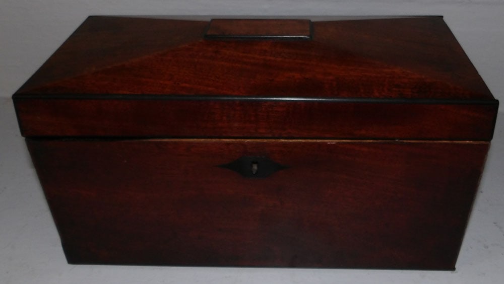 19th century mahogany tea caddy: 19th century mahogany tea caddy. 12 1/4" W 6" D 7" H "ALL DESCRIPTIONS AND ANY CONDITION STATEMENT GIVEN BY LANGSTON AUCTION GALLERY ARE STRICTLY OPINIONS AND LANGSTON'S SHALL HAVE NO RESPONSIBILITY F
