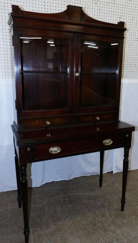 mahogany ladies desk with bookcase top: mahogany ladies desk with bookcase top . 34 1/4" W 17 1/2" D 63" H "ALL DESCRIPTIONS AND ANY CONDITION STATEMENT GIVEN BY LANGSTON AUCTION GALLERY ARE STRICTLY OPINIONS AND LANGSTON'S SHALL HAVE NO RE