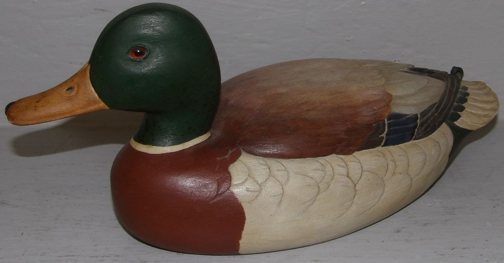 painted carved wood duck decoy: painted carved wood duck decoy . 12 1/2" L "ALL DESCRIPTIONS AND ANY CONDITION STATEMENT GIVEN BY LANGSTON AUCTION GALLERY ARE STRICTLY OPINIONS AND LANGSTON'S SHALL HAVE NO RESPONSIBILITY FOR ERRORS 
