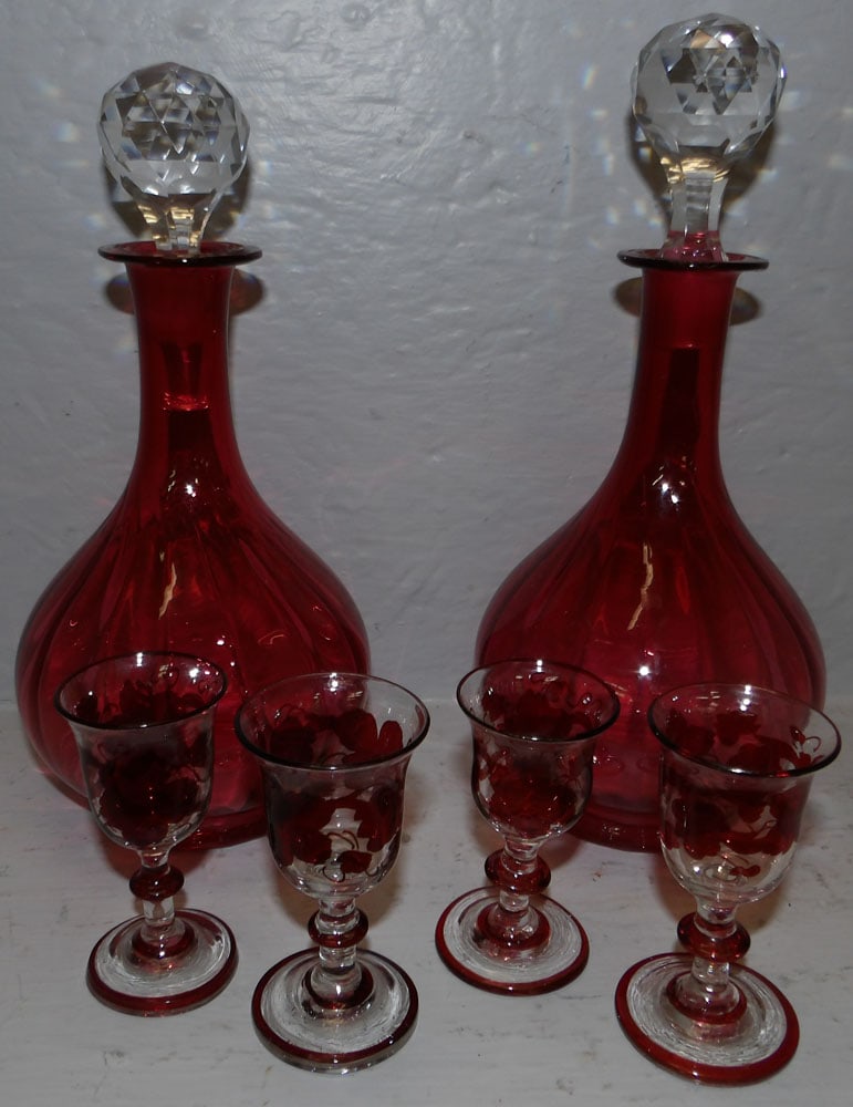 Pair of Cranberry Glass Decanters & Four Ruby to Clear Wine Cordials: Pair of Cranberry Glass Decanters & Four Ruby to Clear Wine Cordials. Up to 10 1/4" H "ALL DESCRIPTIONS AND ANY CONDITION STATEMENT GIVEN BY LANGSTON AUCTION GALLERY ARE STRICTLY OPINIONS AND LANGSTON