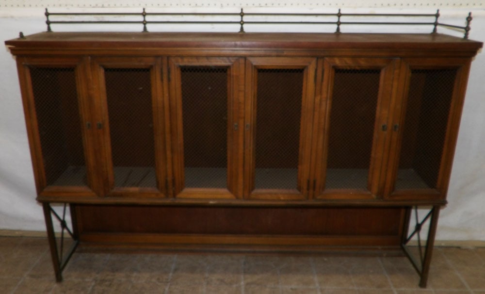 Walnut Mesh Door Cabinet: Walnut Mesh Door Cabinet. 61 3/4" W 11 3/4" D 42 1/4" H ALL DESCRIPTIONS AND ANY CONDITION STATEMENT GIVEN BY LANGSTON AUCTION GALLERY ARE STRICTLY OPINIONS AND LANGSTON'S SHALL HAVE NO RESPONSIBILITY