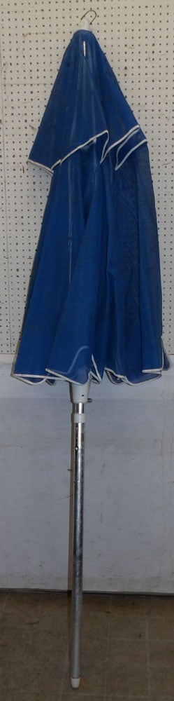 Large Umbrella: Large Umbrella . ALL DESCRIPTIONS AND ANY CONDITION STATEMENT GIVEN BY LANGSTON AUCTION GALLERY ARE STRICTLY OPINIONS AND LANGSTON'S SHALL HAVE NO RESPONSIBILITY FOR ERRORS OR OMISSIONS. THE ABSENCE O