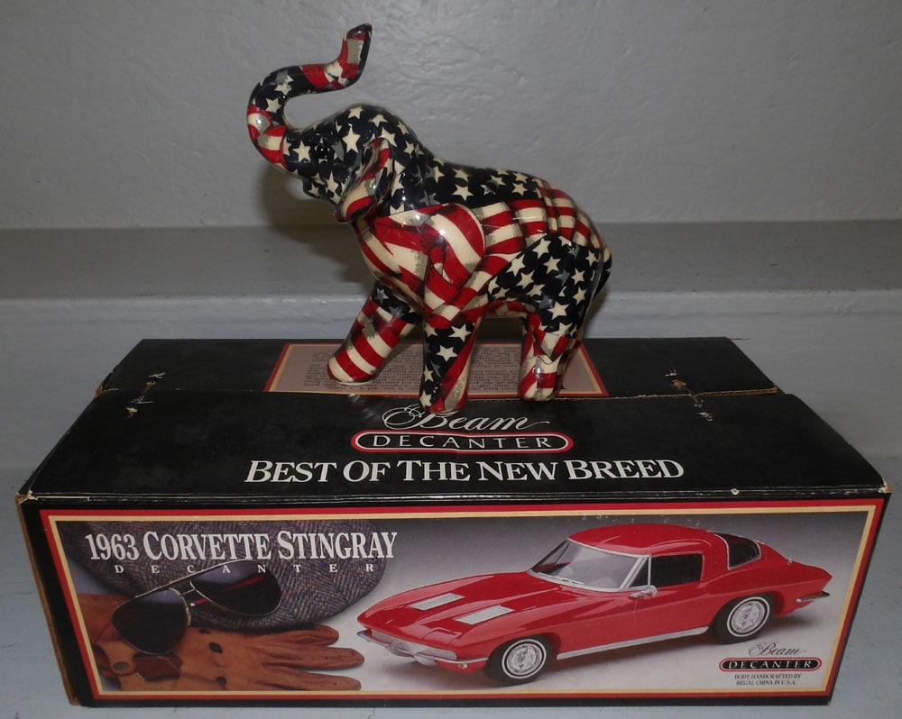 Porcelain Elephant Figurine & Beam Decanter in Box: Porcelain Elephant Figurine & Beam Decanter in Box. Up to 16 1/4" W 7 1/2" D 6" H ALL DESCRIPTIONS AND ANY CONDITION STATEMENT GIVEN BY LANGSTON AUCTION GALLERY ARE STRICTLY OPINIONS AND LANGSTON'S SH