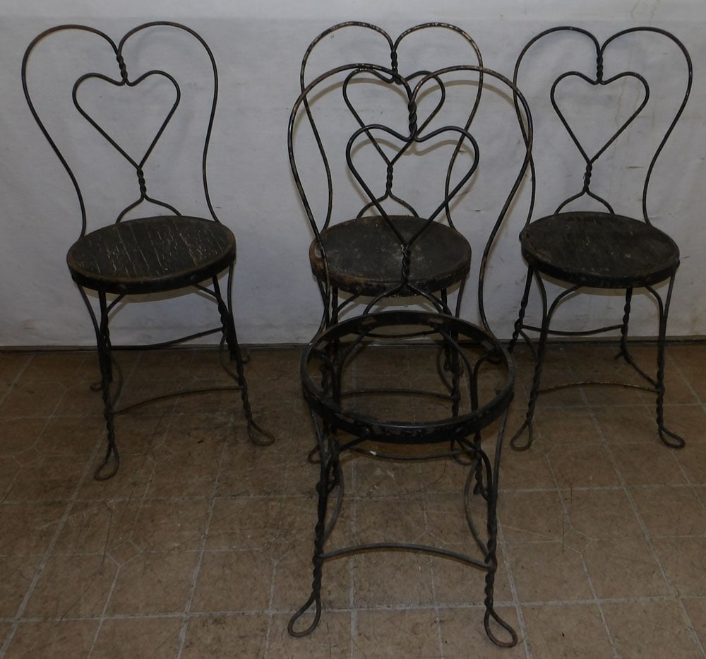 Set of Four Painted Wrought Iron Chairs: Set of Four Painted Wrought Iron Chairs . 35 1/2" H ALL DESCRIPTIONS AND ANY CONDITION STATEMENT GIVEN BY LANGSTON AUCTION GALLERY ARE STRICTLY OPINIONS AND LANGSTON'S SHALL HAVE NO RESPONSIBILITY FOR