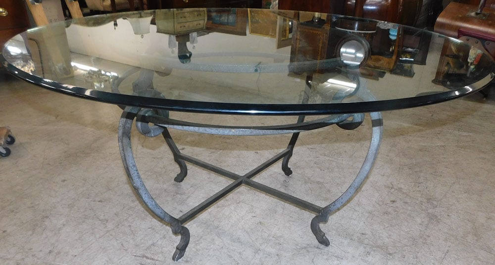 Heavy round glass top table with wrought iron base (1 of 3)