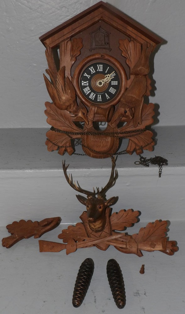 Carved Wood Cuckoo Clock: Carved Wood Cuckoo Clock . ALL DESCRIPTIONS AND ANY CONDITION STATEMENT GIVEN BY LANGSTON AUCTION GALLERY ARE STRICTLY OPINIONS AND LANGSTON'S SHALL HAVE NO RESPONSIBILITY FOR ERRORS OR OMISSIONS. THE