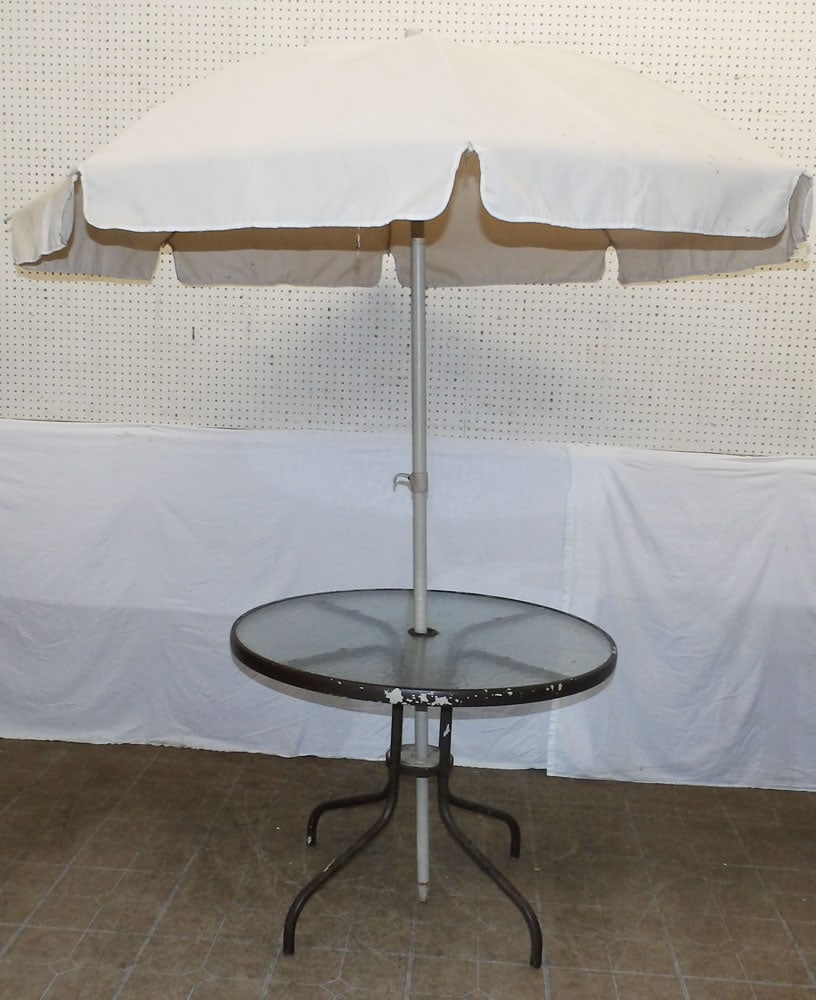 Painted Metal & Glass Top Outdoor Table: Painted Metal & Glass Top Outdoor Table. 36" Dia. 28" H ALL DESCRIPTIONS AND ANY CONDITION STATEMENT GIVEN BY LANGSTON AUCTION GALLERY ARE STRICTLY OPINIONS AND LANGSTON'S SHALL HAVE NO RESPONSIBILITY