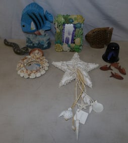 lot of painted resin, carved marble, and pottery beach decorative items