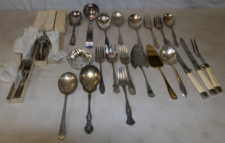lot of silver plated flatware and serving pieces
