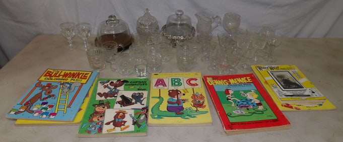 lot of clear glass items and children's books