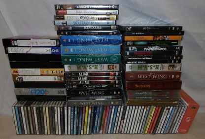 lot of cds, vhs tapes and DVDs