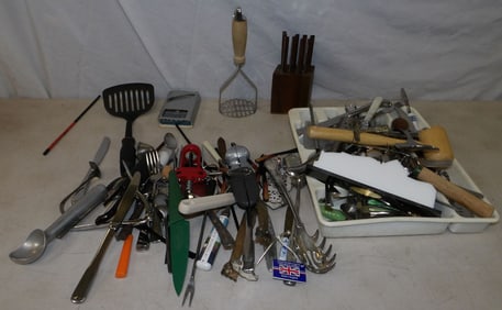 lot of flatware and kitchen utensils