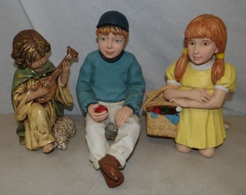 lot of painted resin and ceramic statues