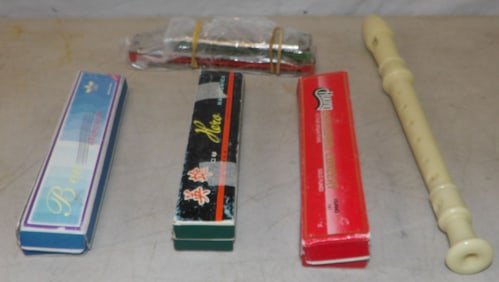 5 vintage harmonicas and one flute