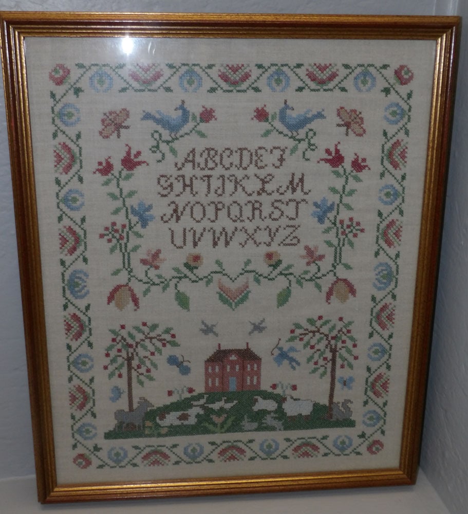 framed needlework sampler: framed needlework sampler. 17 1/2" x 21 1/4" "ALL DESCRIPTIONS AND ANY CONDITION STATEMENT GIVEN BY LANGSTON AUCTION GALLERY ARE STRICTLY OPINIONS AND LANGSTON'S SHALL HAVE NO RESPONSIBILITY FOR ERROR