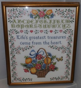 framed needlework sampler