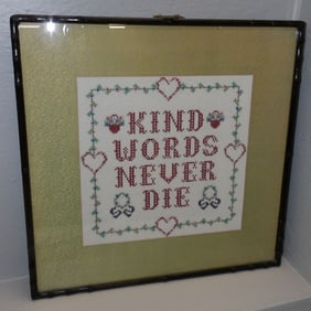 framed needlework sampler