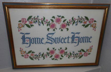 framed needlework sampler