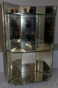small mirror back and glass corner shelf