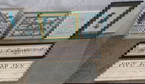lot of frame prints and painted wood sign