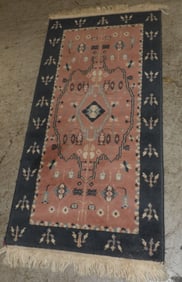 2' by 9' 3" machine made rug