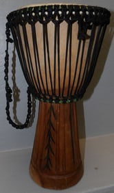 carved wood and animal skin tribe drum