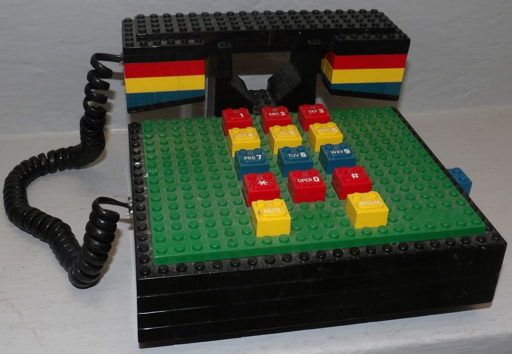 Tyco Lego telephone: Tyco Lego telephone . 7" W 7 1/2" D "ALL DESCRIPTIONS AND ANY CONDITION STATEMENT GIVEN BY LANGSTON AUCTION GALLERY ARE STRICTLY OPINIONS AND LANGSTON'S SHALL HAVE NO RESPONSIBILITY FOR ERRORS OR OMIS