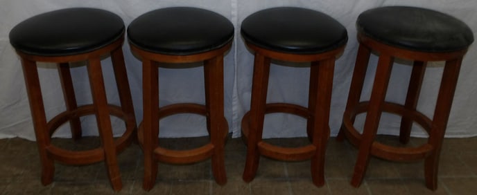 four mahogany bar stools