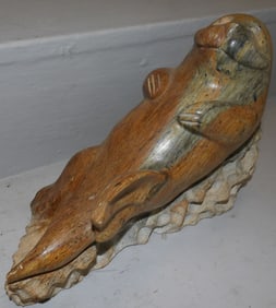 carved stone sea lion sculpture signed and dated by artist