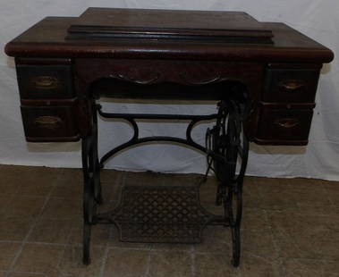 antique oak sewing machine: antique oak sewing machine. 34" W 18" D 31 1/2" H "ALL DESCRIPTIONS AND ANY CONDITION STATEMENT GIVEN BY LANGSTON AUCTION GALLERY ARE STRICTLY OPINIONS AND LANGSTON'S SHALL HAVE NO RESPONSIBILITY FOR