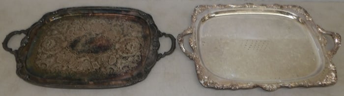 two silver plated serving trays
