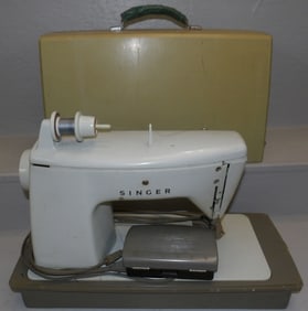 vintage sewing machine in case