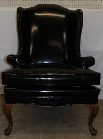 vinyl upholstered Queen Anne wing back chair