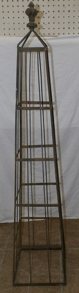 metal stand in obelisk form: metal stand in obelisk form. 46" H "ALL DESCRIPTIONS AND ANY CONDITION STATEMENT GIVEN BY LANGSTON AUCTION GALLERY ARE STRICTLY OPINIONS AND LANGSTON'S SHALL HAVE NO RESPONSIBILITY FOR ERRORS OR OMISS