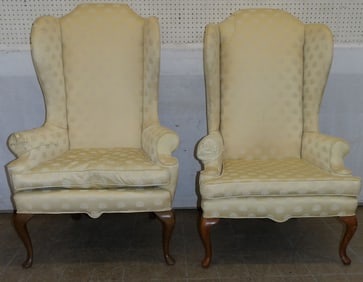 pair of cherry and upholstered wingback chairs