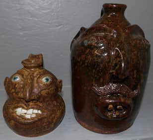 Two Pottery Face Jugs, (One Signed V. Bast 2004)
