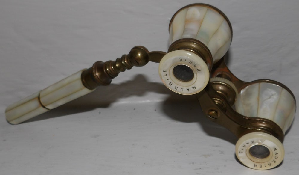 mother of pearl and brass opera glasses: mother of pearl and brass opera glasses . 6" L "ALL DESCRIPTIONS AND ANY CONDITION STATEMENT GIVEN BY LANGSTON AUCTION GALLERY ARE STRICTLY OPINIONS AND LANGSTON'S SHALL HAVE NO RESPONSIBILITY FOR ERR