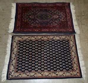 Two 1' 11" by 3' 1" handmade Oriental rugs