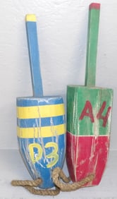 2 painted carved wood buoys