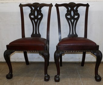 pair of carved mahogany side chairs with ball and claw feet