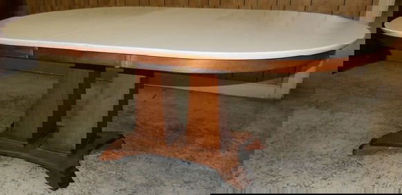 cherry and faux marble top oval dining table with one leaf