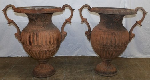 pair of antique cast iron urns