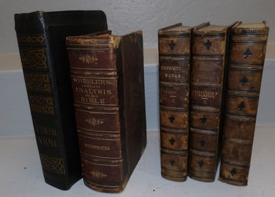 four antique leather bound books and a Bible