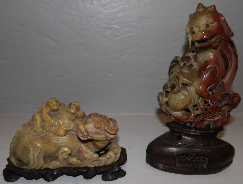 Chinese carved soapstone water buffalo and foo dog: Chinese carved soapstone water buffalo and foo dog . Up to 8 1/4" H "ALL DESCRIPTIONS AND ANY CONDITION STATEMENT GIVEN BY LANGSTON AUCTION GALLERY ARE STRICTLY OPINIONS AND LANGSTON'S SHALL HAVE NO R