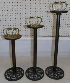 3 graduated brass candlesticks