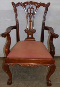 carved mahogany Chippendale arm chair with ball and claw feet